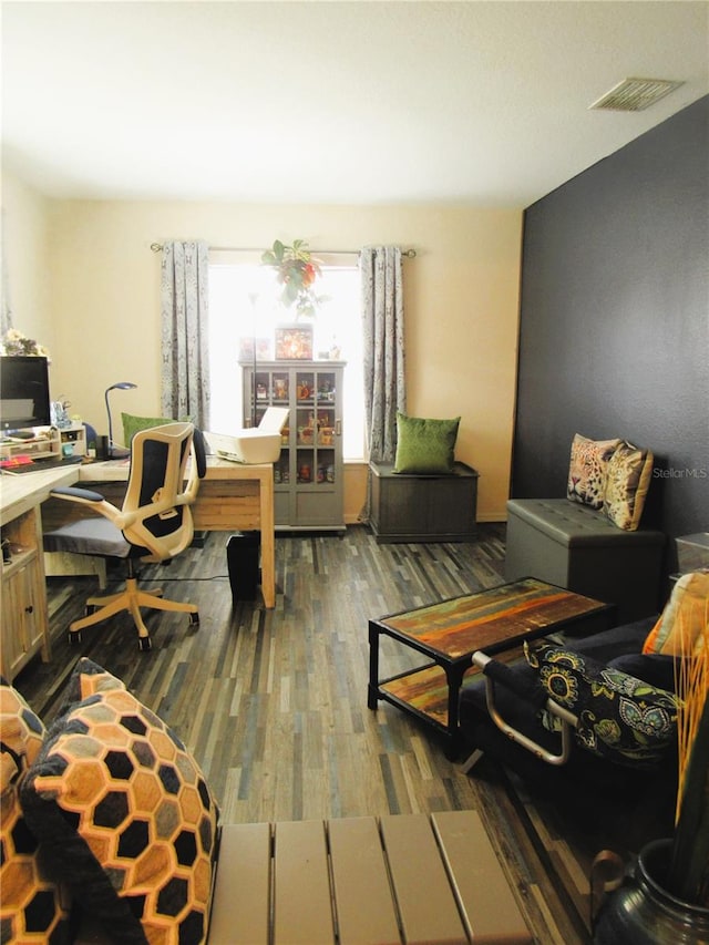 office area with visible vents and wood finished floors