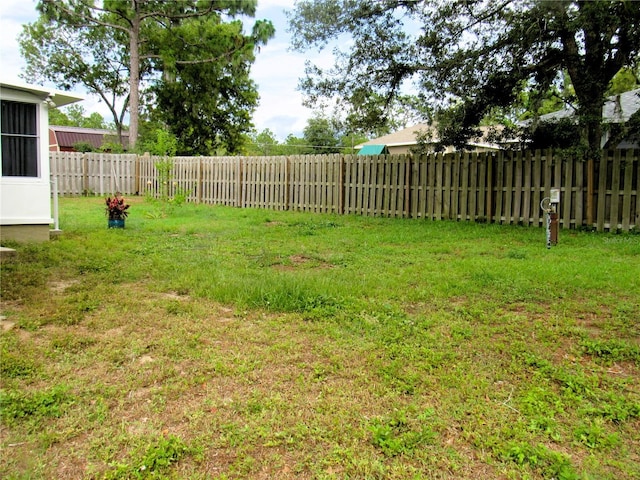 view of yard featuring a fenced backyard