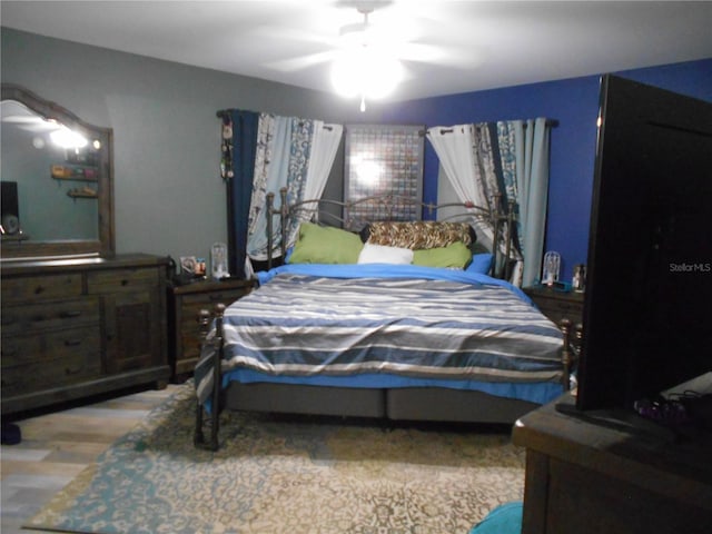 bedroom featuring ceiling fan and wood finished floors