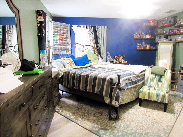 bedroom featuring wood finished floors