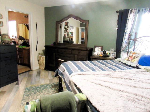 bedroom featuring light wood-style floors