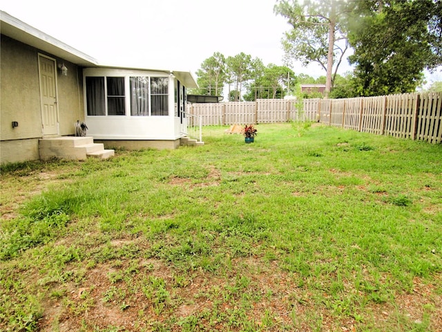 view of yard featuring a fenced backyard