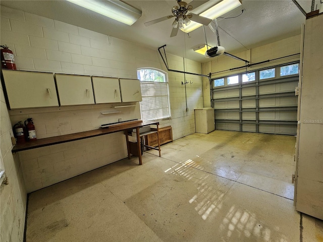 garage featuring a garage door opener and ceiling fan