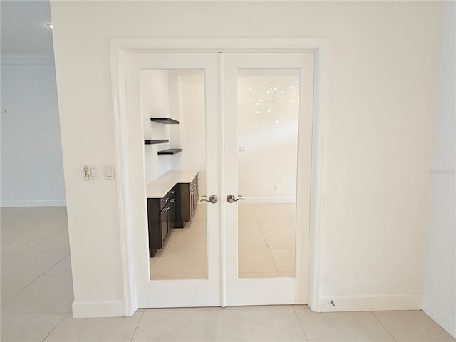 interior space featuring tile floors and french doors