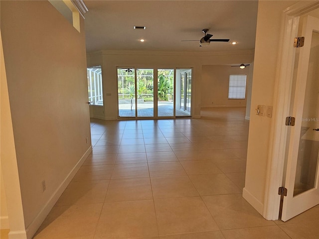 empty room featuring ceiling fan and light tile flooring