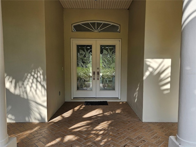 property entrance featuring french doors