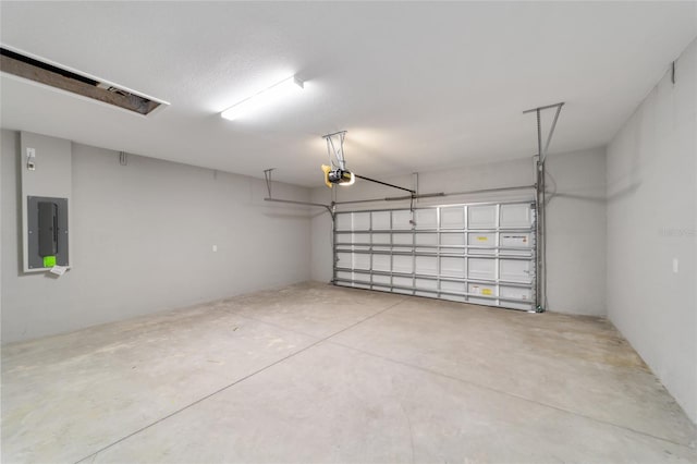 garage with electric panel and a garage door opener