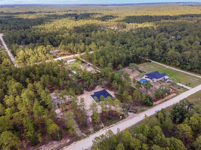 drone / aerial view with a view of trees