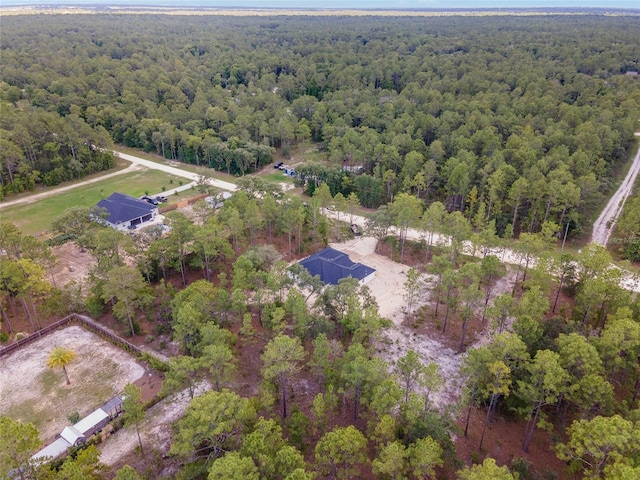 bird's eye view featuring a view of trees