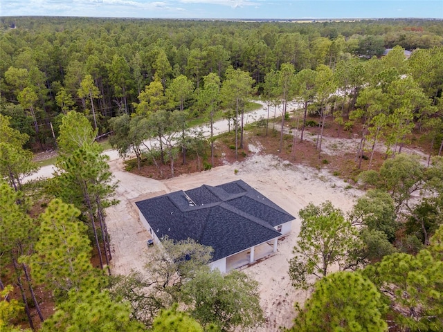 bird's eye view featuring a view of trees