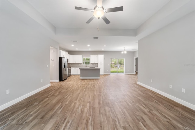 13359 SW 80th St, Dunnellon, FL 34432 - unfurnished living room with light wood-type flooring, baseboards, a ceiling fan, and recessed lighting