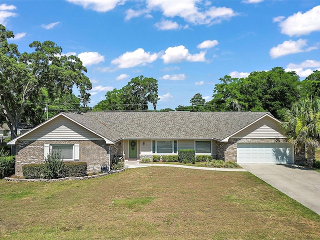 ranch-style house with a garage and a front lawn