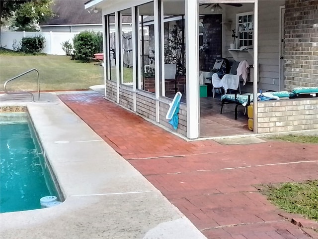 view of patio with a fenced in pool