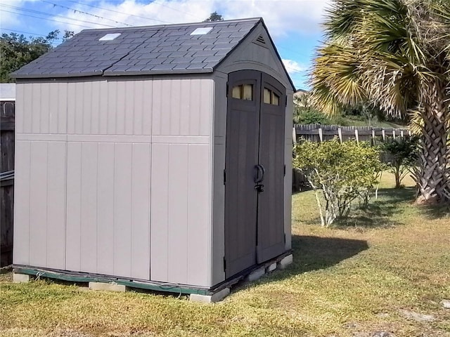 view of outdoor structure featuring a lawn