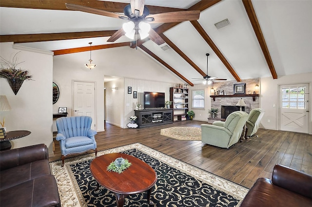 living room featuring beam ceiling, ceiling fan, a stone fireplace, high vaulted ceiling, and hardwood / wood-style flooring