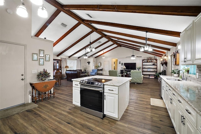 kitchen with vaulted ceiling with beams, white cabinetry, sink, and electric stove