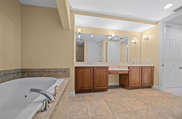 bathroom with tile flooring, tiled bath, and double sink vanity