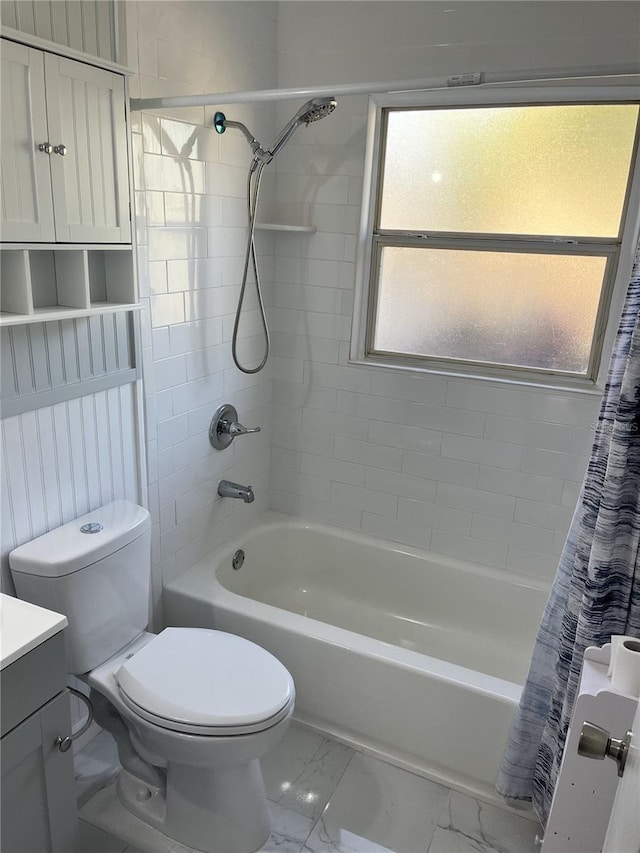 full bathroom with shower / bath combo, vanity, and toilet