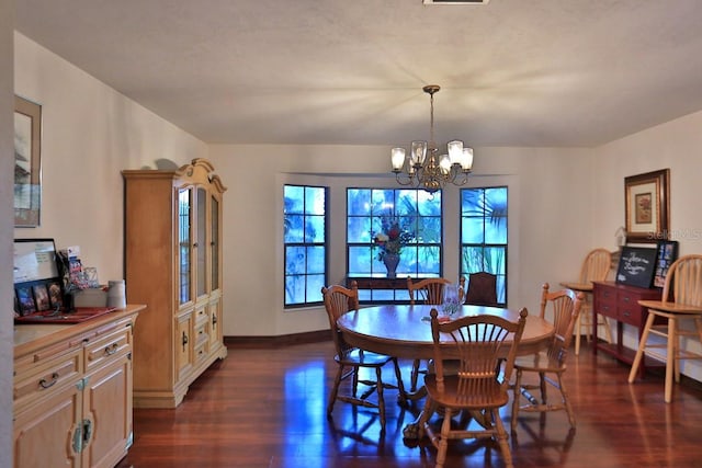 18001 SE Hawthorne Rd, Hawthorne, FL 32640 - dining area with dark wood-type flooring, baseboards, and a chandelier