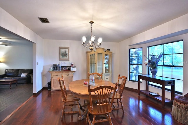 18001 SE Hawthorne Rd, Hawthorne, FL 32640 - dining space with an inviting chandelier, dark wood-style flooring, baseboards, and visible vents