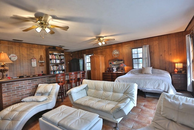 18001 SE Hawthorne Rd, Hawthorne, FL 32640 - bedroom featuring visible vents, tile patterned floors, wooden walls, and multiple windows