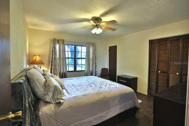 bedroom featuring a closet, ceiling fan, and dark hardwood / wood-style flooring