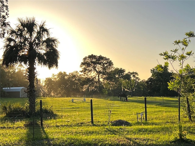 surrounding community with a lawn and a rural view