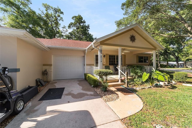 ranch-style house featuring a garage and covered porch