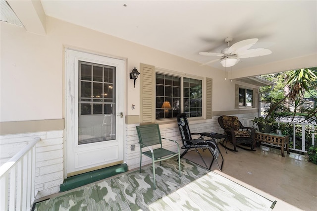 wooden terrace featuring ceiling fan