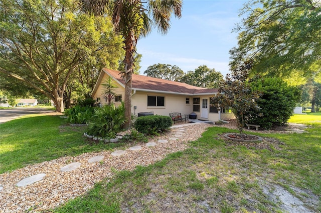 rear view of house with a lawn