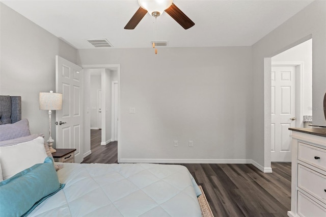 bedroom with dark hardwood / wood-style floors and ceiling fan