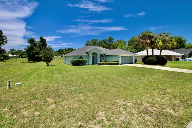 ranch-style home with a garage and a front lawn