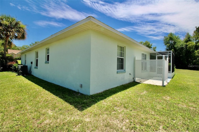 view of property exterior featuring a lawn