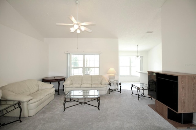 carpeted living room featuring lofted ceiling and ceiling fan