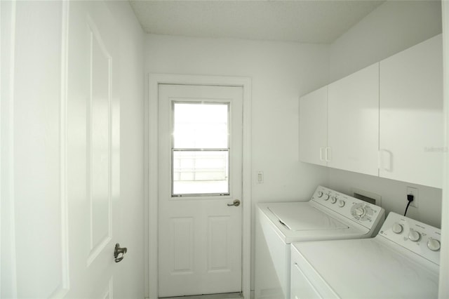 laundry area with cabinets, independent washer and dryer, and washer hookup