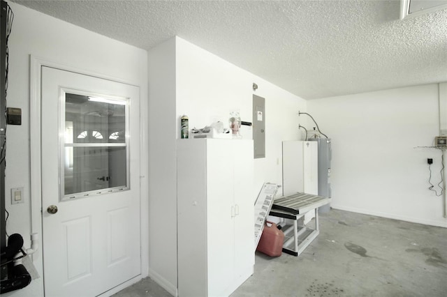 interior space featuring a textured ceiling and concrete flooring