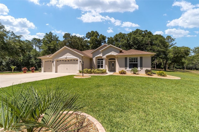 view of front of property with a front yard and a garage