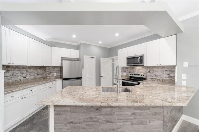 kitchen with kitchen peninsula, white cabinetry, stainless steel appliances, and light stone counters