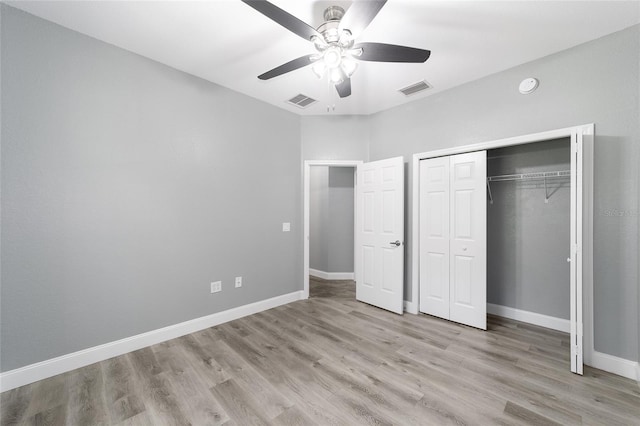 10020 SW 202nd Cir, Dunnellon, FL 34431 - unfurnished bedroom with light wood finished floors, a closet, and ceiling fan