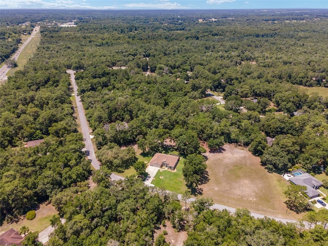 drone / aerial view with a view of trees