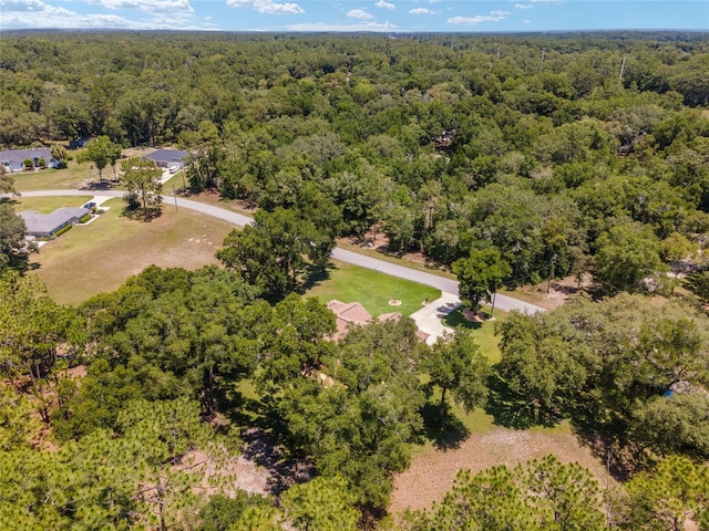 bird's eye view featuring a wooded view