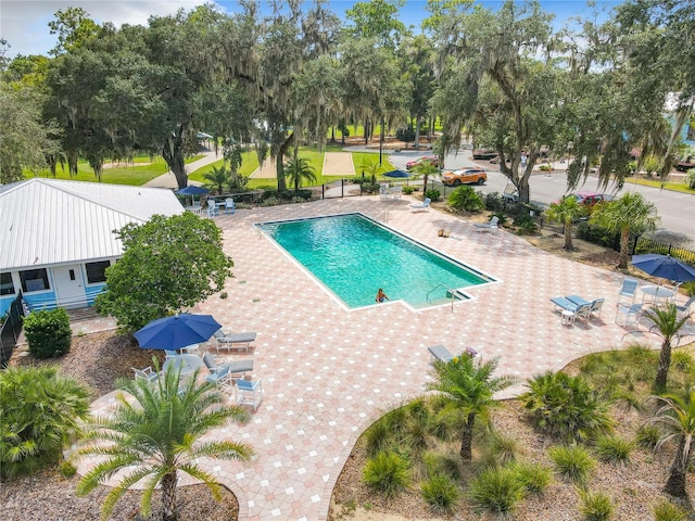 view of swimming pool with a patio