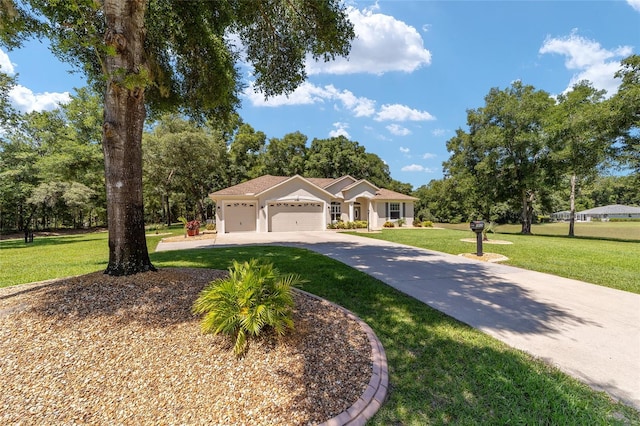 view of front facade with a garage and a front yard