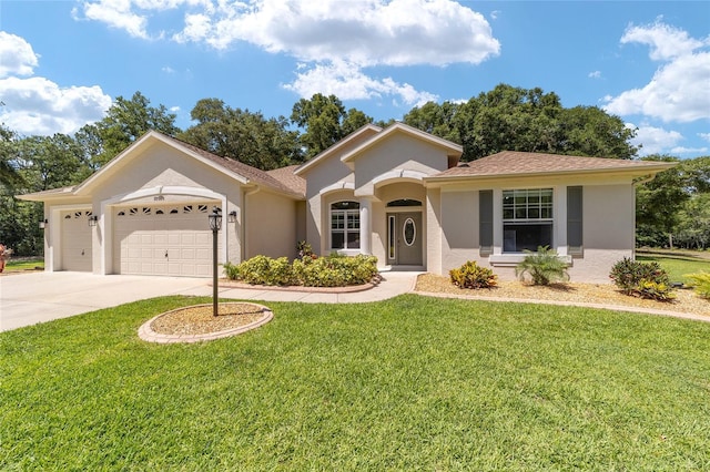 ranch-style home with a garage and a front lawn