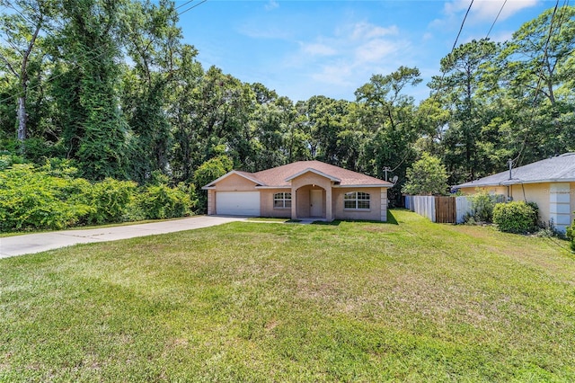 single story home featuring a garage and a front lawn