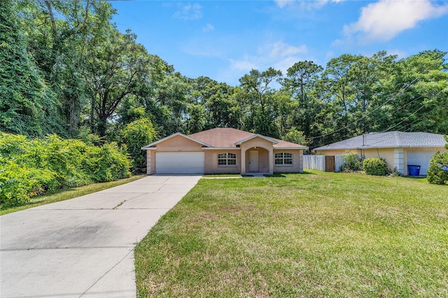 ranch-style home with a garage and a front lawn