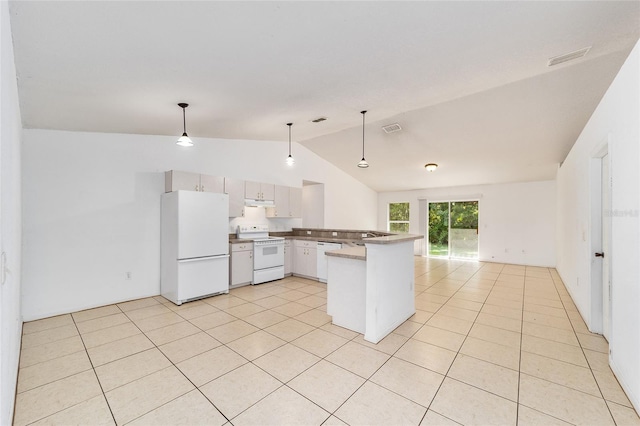 kitchen with white appliances, vaulted ceiling, decorative light fixtures, light tile patterned flooring, and kitchen peninsula