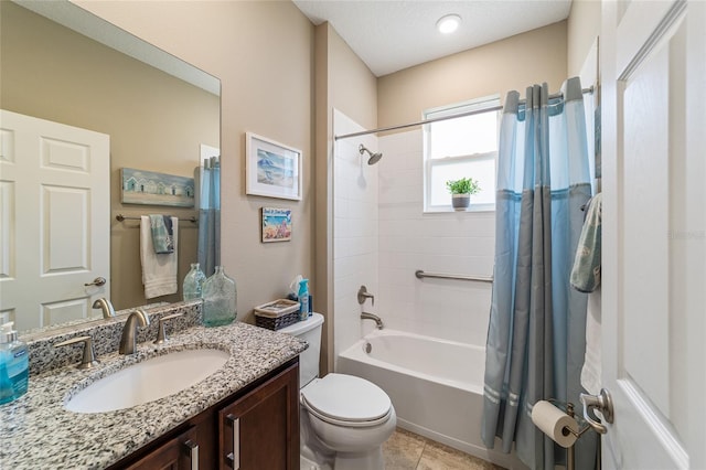 full bathroom featuring tile patterned flooring, shower / bath combo, toilet, and vanity