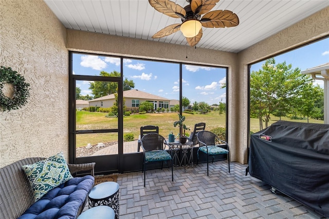 sunroom / solarium with ceiling fan