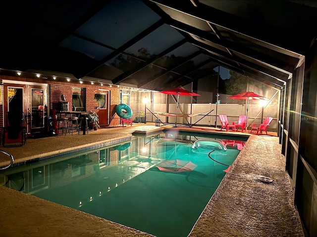 view of pool at night